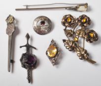 SIX VINTAGE SILVER AND COLOURED STONE BROOCHES