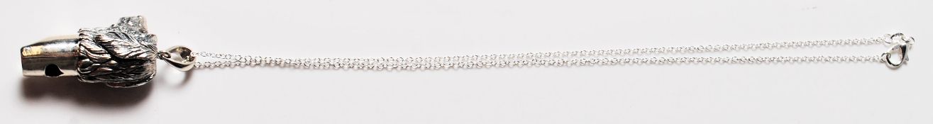 STERLING SILVER WHITLE IN THE FORM OF A DOG