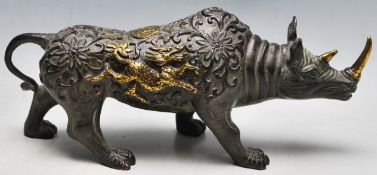 A 20TH CENTURY CHINESE BRONZE RHINO