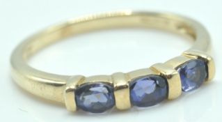 9CT GOLD AND AMETHYST THREE STONE RING