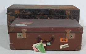EARLY 20TH CENTURY MILITARY METAL SHIPPING TRUNK AND A BROWN LEATHER SUITCASE