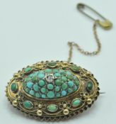 19TH CENTURY VICTORIAN YELLOW METAL, TURQUOISE AND WHITE STONE BROOCH
