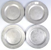 FOUR 18TH CENTURY GEORGIAN PEWTER CHARGER PLATES