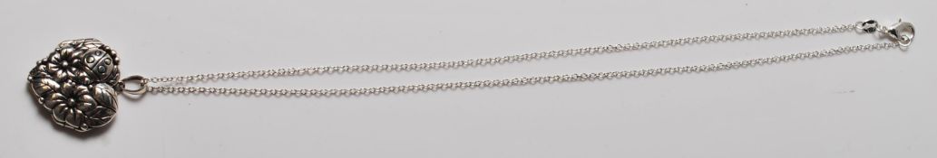 .925 SILVER HEART SHAPED SILVER PENDANT DECORATED WITH FLOWERS AND A LADYBIRD