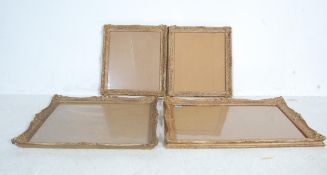 FOUR BAROQUE STYLE GILDED PICTURE FRAMES