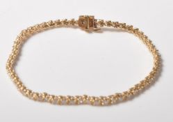 14CT GOLD DIAMOND SET BRACELET