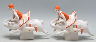A pair of vintage style Art Deco revival ceramic bookends having two flapper girls riding pigs.