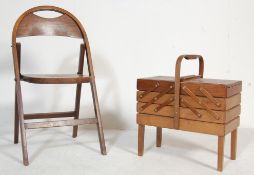 1950’S OAK FRAME FOLDING CHAIR AND METAMORPHIC SEWING BOX