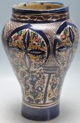 A LATE 19TH CENTURY ISLAMIC / PERSIAN / QAJAR PERIOD VASE HAVING IZNIK STYLE DECORATION.