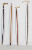 COLLECTION OF FOUR ANTIQUE EDWARDIAN AND LATER WALKING STICKS