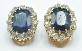 A pair of 14ct gold clip on, blue stone and diamon