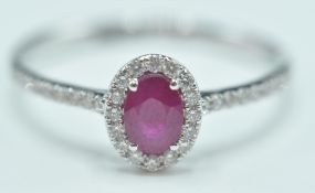 18CT WHITE GOLD LADIES DRESS RING WITH RUBY AND DI