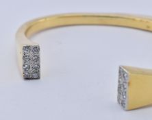 18CT GOLD AND DIAMOND BANGLE BRACELET