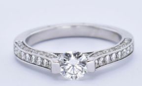 18CT GOLD AND DIAMOND TENSION SET SOLITAIRE RING