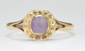 STAMPED 18K GOLD RING WITH PURPLE STONE