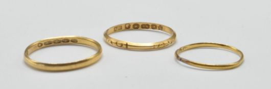 THREE ANTIQUE AND LATER GOLD BAND RINGS