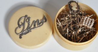 A late Victorian silver hallmarked ivorine pin box. The box of roundel form with silver hallmarked '