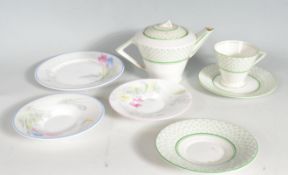 1930S ART DECO TEAPOT TOGETHER WITH MATCHING TEA CUP AND SAUCERS.