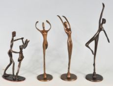 FOUR BRASS DANCING STATUES
