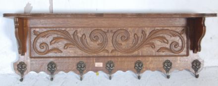 20TH CENTURY OAK CARVED WALL MOUNTED COAT RACK