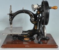 19TH CENTURY VICTORIAN WILCOX AND GIBBS HAND OPERATED CAST IRON SEWING MACHINE