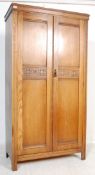 JACOBEAN REVIVAL CARVED OAK BACHELORS WARDROBE