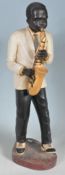 TWO LARGE CERAMIC FIGURINES OF A JAZZ BAND PLAYERS