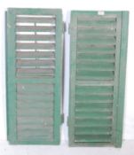 TWO ITALIAN GREEN PAINTED WOODEN SHUTTERS