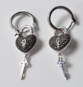 PAIR OF STAMPED 925 SILVER LADIES HEART HOOP EARRINGS.