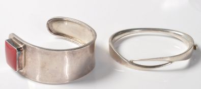 TWO SILVER STAMPED 925 BANGLE BRACELETS.
