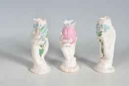 COLLECTION OF THRE ANTIQUE LADIES HAND VASES