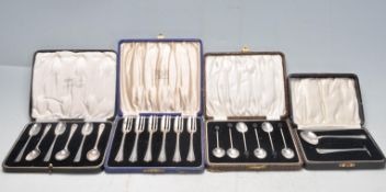 FOUR 20TH CENTURY CASED SILVER WARE