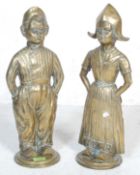 TWO BRASS DUTCH BRASS FIGURINE DOOR STOPS