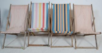 COLLECTION OF FOUR VINTAGE FOLDING DECK CHAIRS