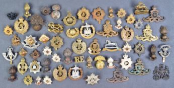 COLLECTION OF ASSORTED WWII AND WWII MILITARY CAP BADGES