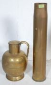 1957 NAVY BRASS SHELL AND A HAND CRAFTED JUG