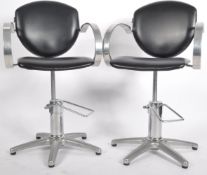 REM - MATCHING PAIR OF ADJUSTABLE BARBER'S ARMCHAIRS