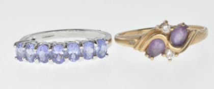 TWO 9CT GOLD AND PURPLE STONE RINGS