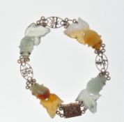 STAMPED 14K GOLD CHINESE CARVED JADE BRACELET.