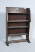 1920’S - 1930’S OAK OPEN WINDOW BOOKCASE IN THE MANNER OF LIBERTY