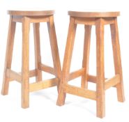 MATCHING PAIR OF ARTS AND CRAFTS OAK BAR STOOLS