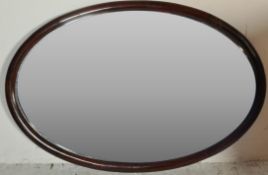 20TH CENTURY EDWARDIAN MAHOGANY OVAL MIRROR