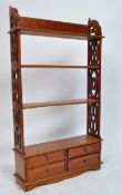 20TH CENTURY HARDWOOD FEET PIERCED WALL MOUNTED BOOKCASE / SPICE RACK