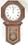 LATE 19TH CENTURY AMERICAN STAINED WALNUT WALL CLOCK