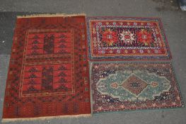 THREE PERSIAN ISLAMIC RUGS