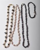 THREE PEARL NECKLACES AND A MATCHING BRACELET.