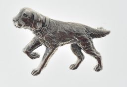 STAMPED STERLING SILVER DOG BROOCH.