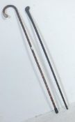 TWO ANTIQUE 20TH CENTURY WALKING STICKS.