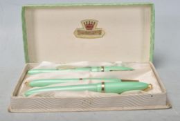 SET OF THREE 1950S QUEENSWAY FOUNTAIN PENS / PROPELLING PENCILS.