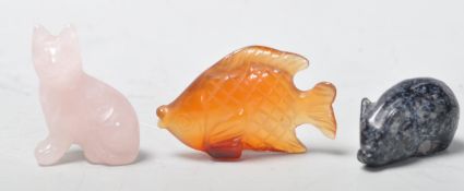 GROUP OF THREE CARVED STONE AND QUARTZ ANIMAL FIGURES.